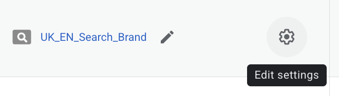 Settings cog beside the UK_EN_Search_Brand campaign name in Google Ads