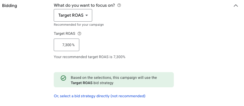 Google Ads bidding settings with Target ROAS selected and a recommended target of 7,300%